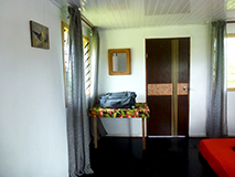 Tanna adventures - Ni-Van child on deck of sleeping Bungalow