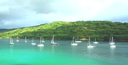 view of yachts  abchored at Port resolution on their voyage through Vanuatu